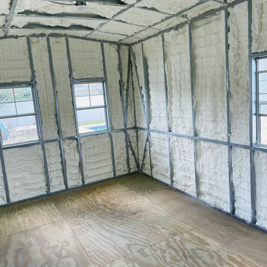 Closed-cell spray foam insulation applied to wall cavities in a residential project in Converse